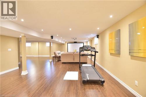 Workout room with light wood-style floors and recessed lighting - 512 Terrington Crescent, Kitchener, ON 