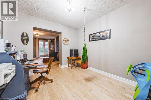 Light-filled room featuring wood-finish flooring and neutral wall tones - 70 Webster Road, Hamilton, ON 