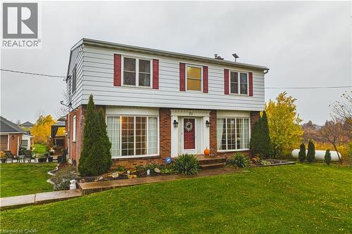 Traditional two-story residence featuring a brick and siding exterior - 70 Webster Road, Hamilton, ON 