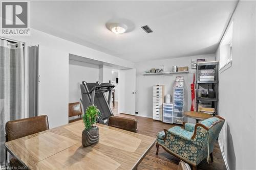 Spacious room featuring wood-finish flooring, white walls, and a recessed ceiling light - 1083 Melton Drive, Mississauga, ON 