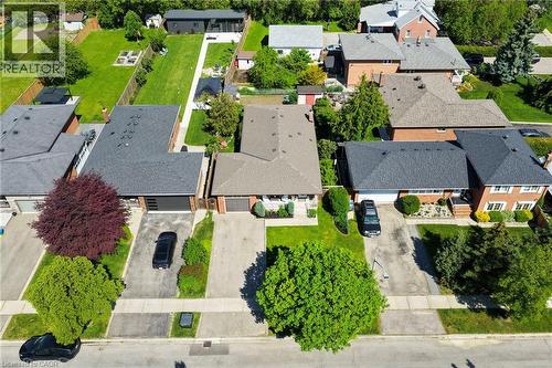 Single-story residence featuring a gray shingle roof and a paved driveway - 1083 Melton Drive, Mississauga, ON 