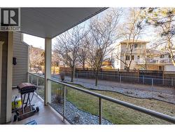 Rear-facing quieter patio backing onto green space and path and not parking lot - 