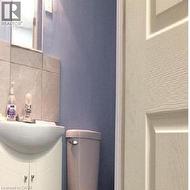 Bathroom vanity with integrated sink, chrome faucet, and mirrored medicine cabinet - 