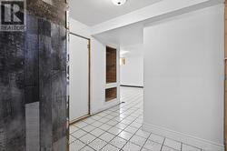 View of rec room from basement landing. - 