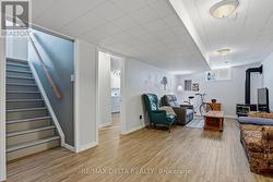 View of stairs & access to laundry room. - 