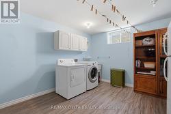 Spacious laundry area w/access to deep storage. - 