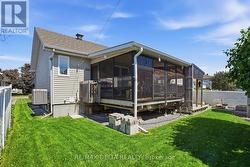 View of the sunroom from the yard. - 