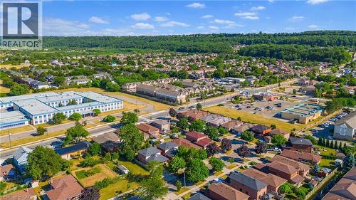 Expansive aerial of a residential community featuring a variety of single-family homes and multi-unit residences - 102 Juniper Drive, Hamilton, ON 