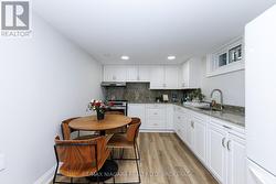 Lots of cabinets and quartz coutertops/backsplash - 