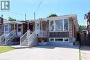 Stone and brick exterior featuring a covered front entry with white railings - 185 Rosslyn Avenue N, Hamilton, ON 