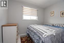 Neutral-toned walls complement the window with banded shades - 