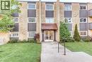 Multi-story building with a brick and vertical panel facade - 75 Hazelglen Drive Unit# 310, Kitchener, ON 