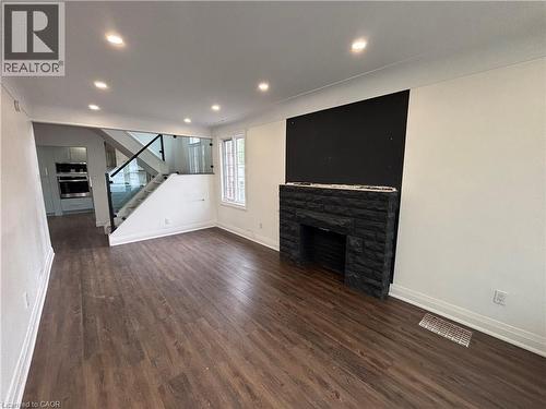 122 Queensdale Avenue E, Hamilton, ON - Indoor With Fireplace