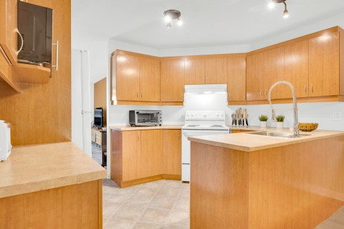 Cuisine - 102-855 Rue Sigouin, Sainte-Adèle, QC - Indoor Photo Showing Kitchen With Double Sink