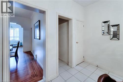 Entryway featuring white square tile flooring - 244 Hughson Street N, Hamilton, ON 