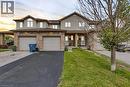 Townhome exterior featuring brick and siding construction - 48 Clough Crescent, Guelph, ON 