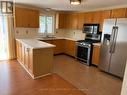 Kitchen with stainless steel appliance - Upper - 29 Irwin Drive, Barrie, ON 