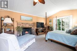 Cozy wood burning fireplace in primary bdrm - 