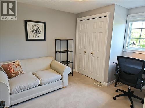 Light-filled room featuring neutral wall tones and a window with natural light - 596 Spinnaker Crescent, Waterloo, ON 