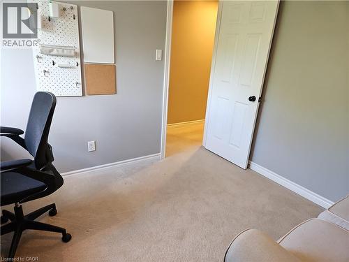 Carpeted room with light grey walls and white trim - 596 Spinnaker Crescent, Waterloo, ON 