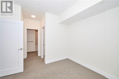 Primary bedroom to walk-in closet and ensuite - 436 - 16 Concord Place, Grimsby (Grimsby Beach), ON 