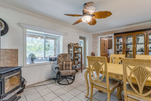 Salle à manger - 756 Ch. De La Baie, Rigaud, QC - Indoor Photo Showing Dining Room With Fireplace