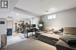 Spacious finished basement featuring recessed lighting and a carpeted lounge area - 
