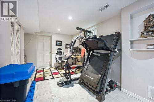 Finished basement space featuring recessed lighting, light-toned wall paint, and tile flooring - 817 Acadia Drive, Hamilton, ON - Indoor Photo Showing Gym Room