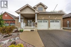 Welcoming front porch and double car driveway and garage - 