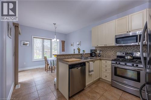 Stainless steel appliances including a gas stove and built-in microwave - 21 Kelly Drive, Port Dover, ON 