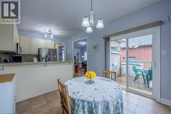 Eat-in kitchen overlookiing the backyard and deck - 