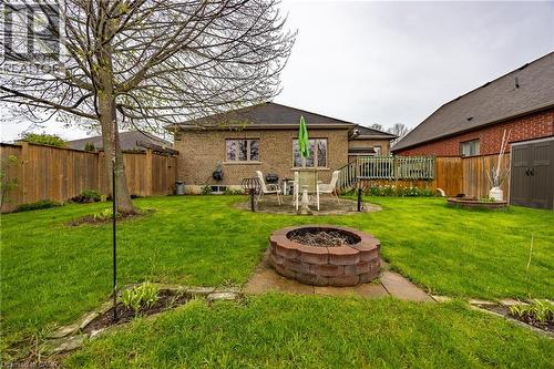 Deck, patio, and firepit zones in the backyard - 21 Kelly Drive, Port Dover, ON 