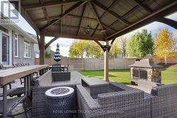 Backyard: Covered Fire Pit and Lounging Area - 