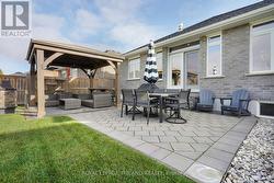 Backyard: Upgraded Patio Stones and Landscaping - 