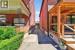 Concrete driveway with brick-clad exterior facades - 