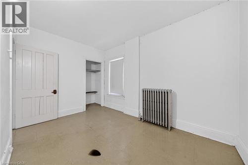 Neutral-toned flooring with white baseboards - 16 Mulberry Street, Hamilton, ON 