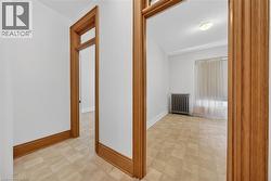 Interior entryway featuring wood-finish door frames and baseboards - 