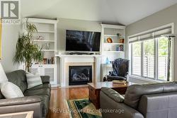 Built-in Cabinets flank the gas Fireplace - 