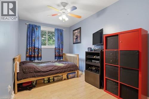 Room featuring light wood-finish flooring and a ceiling fan with integrated lighting - 116 Scott Road, Cambridge, ON 