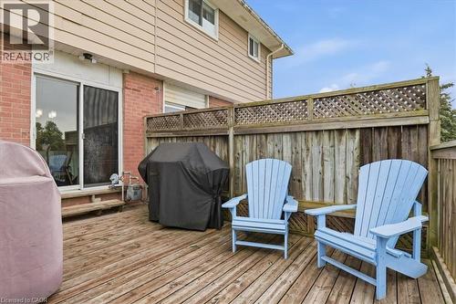 Spacious wood-finish deck with privacy fencing and lattice accents - 116 Scott Road, Cambridge, ON 