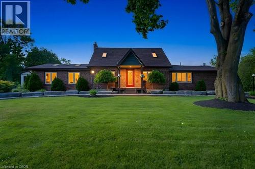 Brick exterior residence with a dark shingle roof and multiple skylights - 3786 Old Beverly Road, North Dumfries, ON 