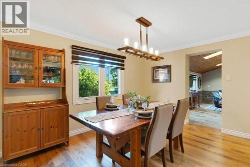 Dining area featuring wood-finish flooring and a rectangular window - 3786 Old Beverly Road, North Dumfries, ON 