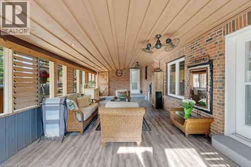 Covered patio featuring wood-finish ceiling, recessed lighting, and ceiling fans - 3786 Old Beverly Road, North Dumfries, ON 