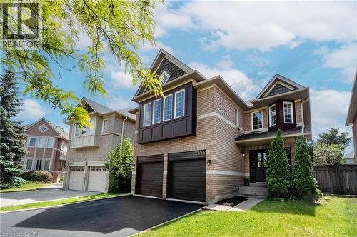 Brick exterior with architectural gables and a double garage - 2425 Nichols Drive, Oakville, ON - Outdoor With Facade