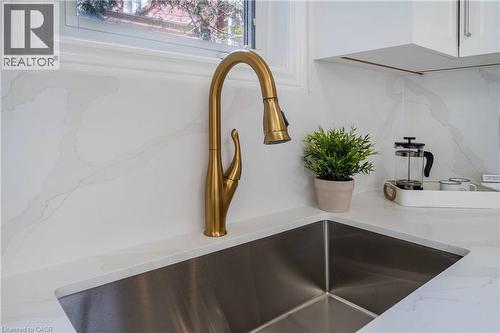 Undermount stainless steel sink with a brass-finish pull-down faucet - 2425 Nichols Drive, Oakville, ON - Indoor