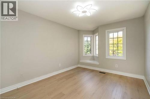 Corner window ensemble with a built-in window seat - 2425 Nichols Drive, Oakville, ON - Indoor Photo Showing Other Room