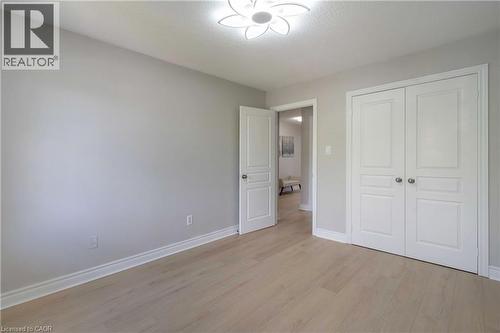 Room featuring wood-finish flooring, light gray wall paint, and white trim - 2425 Nichols Drive, Oakville, ON - Indoor Photo Showing Other Room