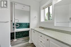 Ensuite door into the shared bathtub/shower room - 