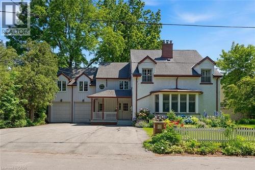 Traditional stucco exterior with dormer windows, featuring a prominent bay window - 3 Ancaster Street E, Dundas, ON - Outdoor With Facade