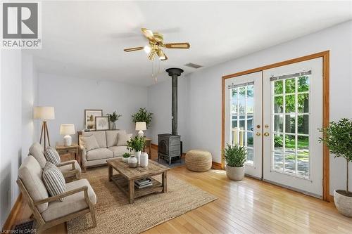 Light wood-finish flooring complements a neutral color palette - 3 Ancaster Street E, Dundas, ON - Indoor Photo Showing Living Room